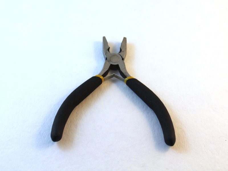 A pair of flat nose pliers