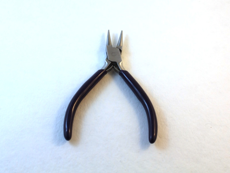 A pair of round nose pliers