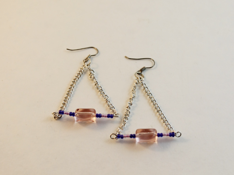 A pair of triangular drop earrings.