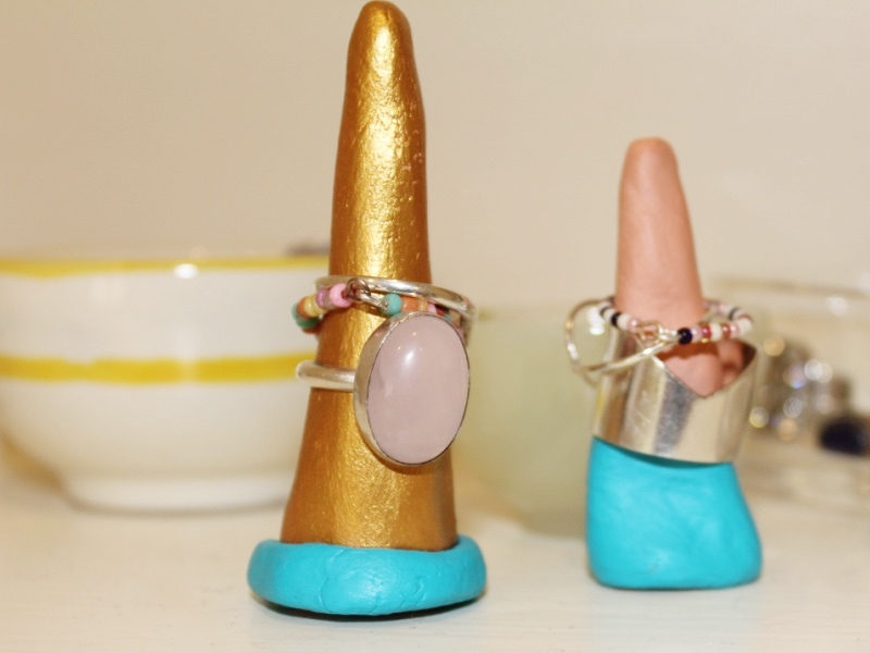 two painted ring holders with rings in place