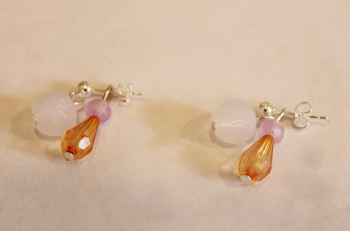 earrings with first charm attached