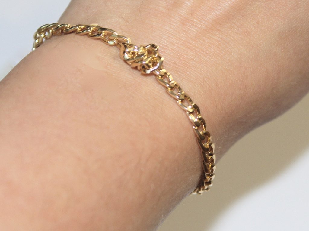 wearing the finished gold chain knot bracelet
