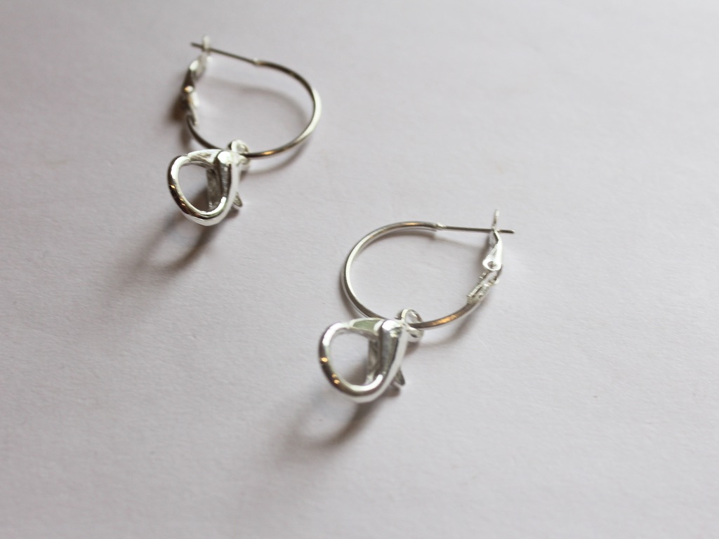 both earrings with clasps attached