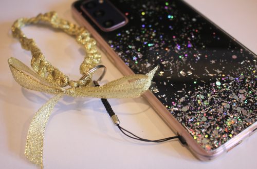the finished crochet ribbon phone strap added to a phone