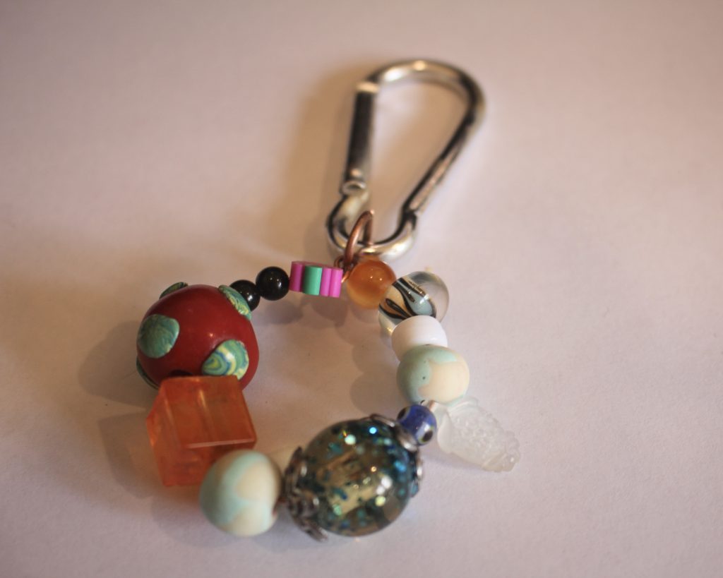 the circle charm added to the carabiner