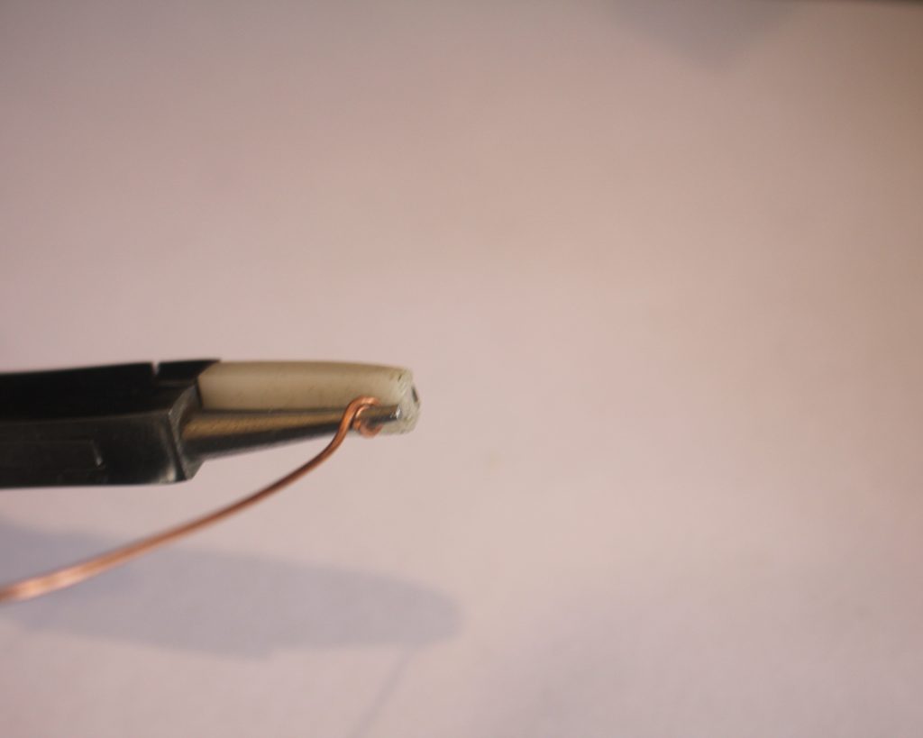 looping end of wire with round flat pliers