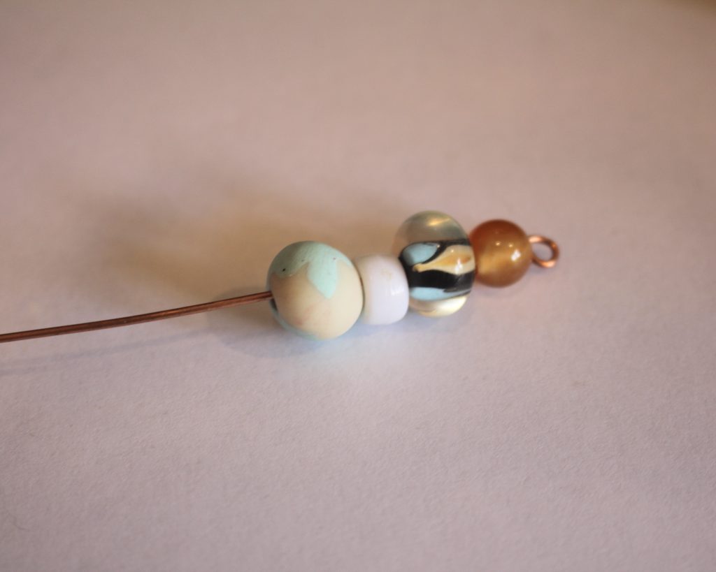 adding beads to the wire