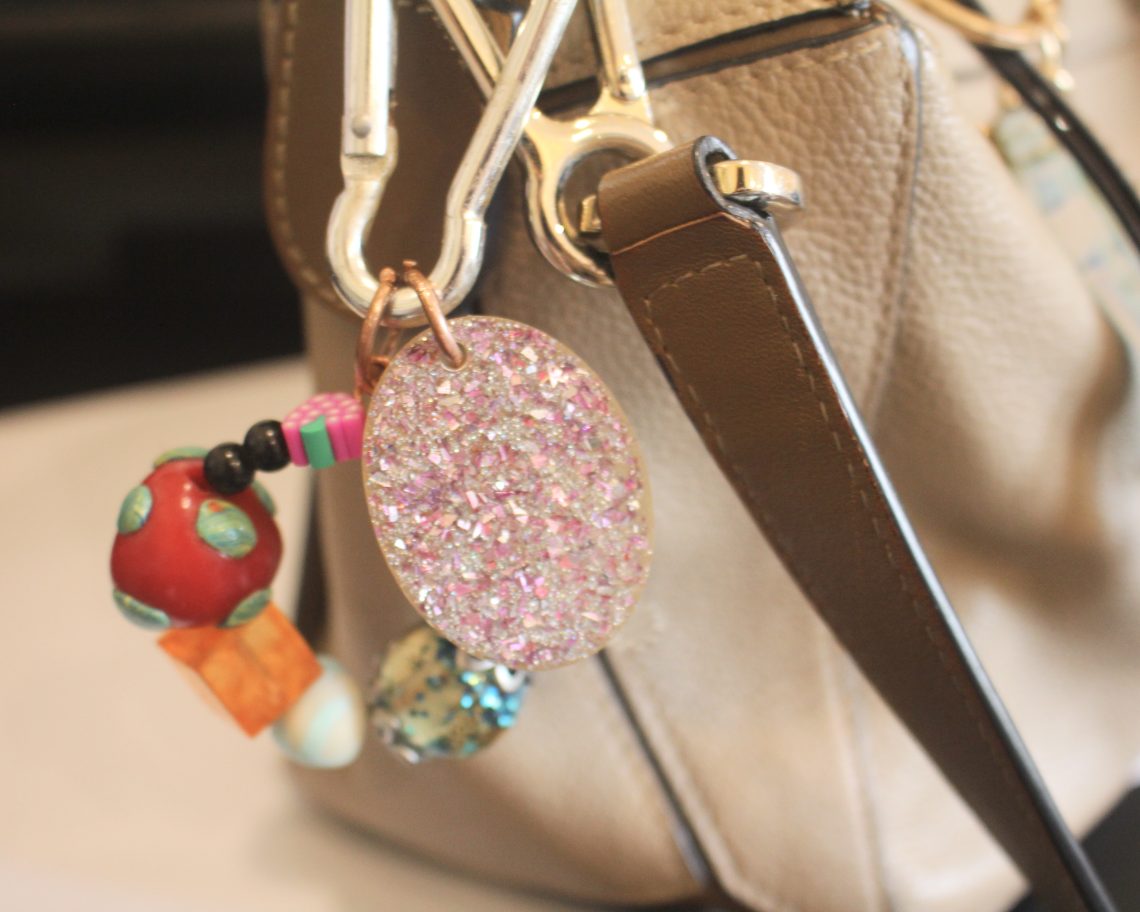 the finished charm added to a handbag