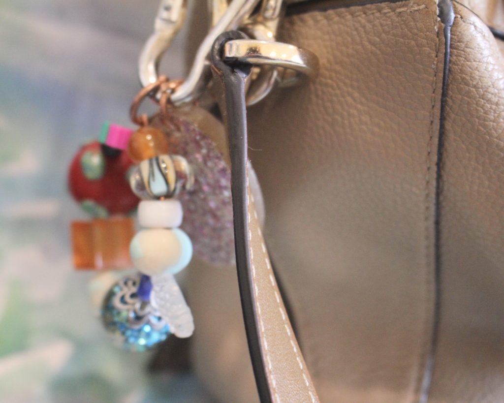 the finished charm added to a handbag